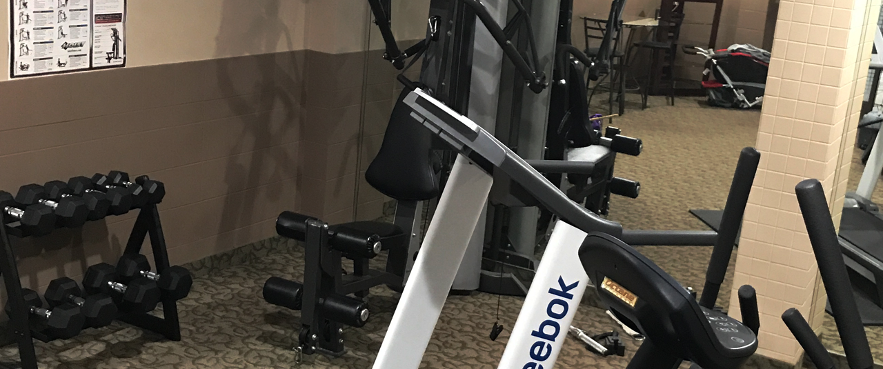 Photo of fitness room with weights at Argyll Plaza Hotel